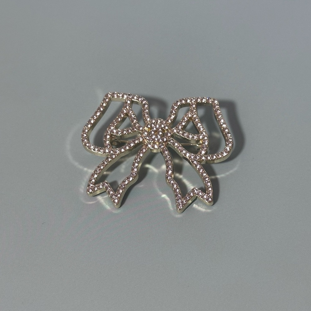 Rhinestone Bow Brooch – Silver-Tone Sparkle